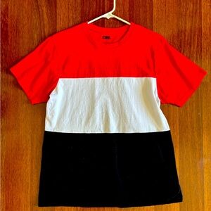 Colorblock tee with a bold red, white, and black color scheme.
